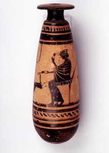Pintura em vaso: alabastro usado para conter o perfume: um rosto retrata uma mulher brincando com uma corça e segurando uma flor. A cesta para segurar a lã está atrás dela. 500 AC. BNF, Medal Office. de Greek