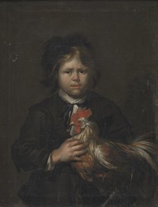 Um menino de fazenda com um galo