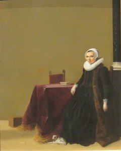 Retrato de uma mulher com um cão de Hendrik Gerritsz Pot
