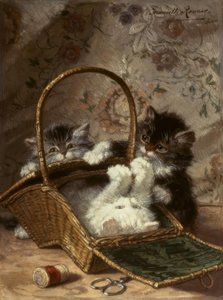 Gatos jovens com uma cesta de costura