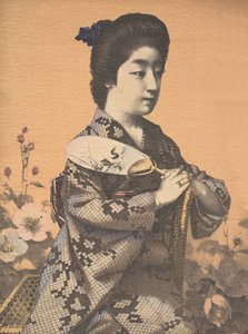 Menina carregando um leque de papel redondo Uchiwa, ca. 1900 de Hugechi