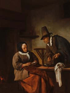 Um casal idoso a preparar uma bebida quente
