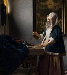 Woman Holding a Balance, c. 1664.