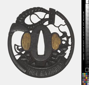 Tsuba: Flores, Scythe, Rope, início do 18º aniversário.
século (Ferro) de Japanese School