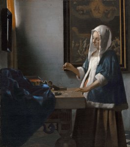 Mulher a segurar uma balança de Johannes Vermeer