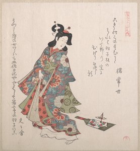 Menina com uma hagoita (raquete e peteca japonesas)