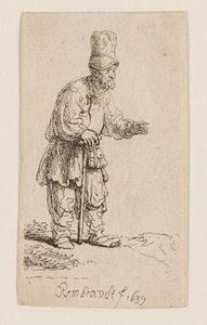 Um camponês com um gorro alto, de pé e apoiado num bastão de Rembrandt van Rijn