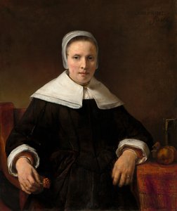 Uma mulher segurando uma rosa, 1656. de Rembrandt van Rijn