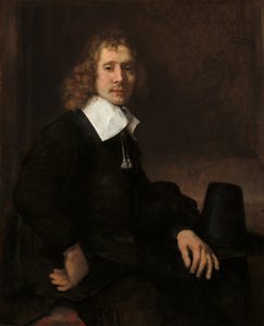 Um jovem sentado em uma mesa possivelmente Govaert Flinck, c. 1660. de Rembrandt van Rijn