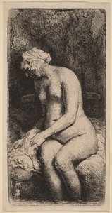 Nua, sentada num banco com uma almofada (Mulher a lavar os pés num ribeiro) de Rembrandt van Rijn