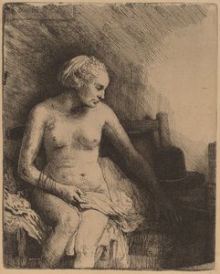 Mulher no banho com um chapéu ao lado dela de Rembrandt van Rijn