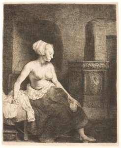 Mulher sentada meio vestida ao lado de um fogão de Rembrandt van Rijn