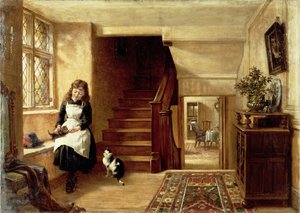 Um interior com uma menina brincando com gatos