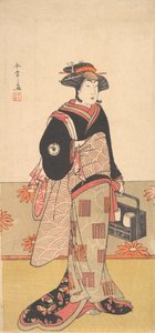 O ator Iwai Hanshiro IV como uma mulher em um quimono preto, ca. 1780. de Shunsho