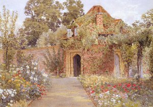 Um jardim murado com casa velha jardim