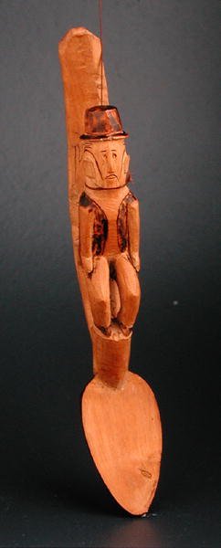 Figura de um homem europeu sentado no eixo de uma colher, África do Sudeste, final do século XIX (madeira) de African