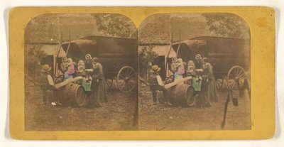 [Grupo familiar em frente a uma carroça, pai e filho em cima de uma serra improvisada]. de Charles Peeters
