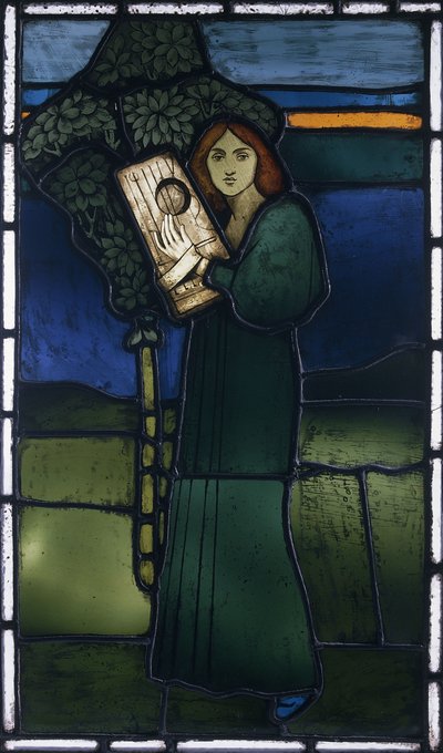 Um painel de vidro com chumbo representando uma figura feminina de corpo inteiro tocando um instrumento de cordas de David Gauld