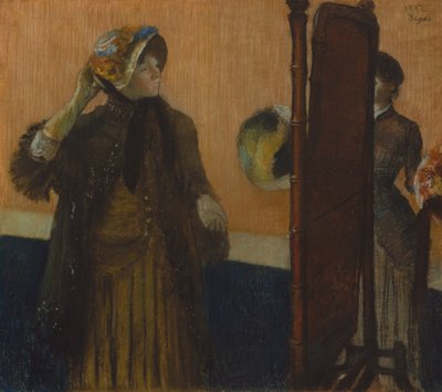 At the Milliners, 1882 (Pastel em papel de seda cinza claro colocado sobre parafusos de seda) de Edgar Degas