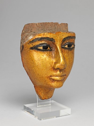Rosto de um caixão, com olhos e sobrancelhas incrustados, dourados de Egyptian 20th Dynasty