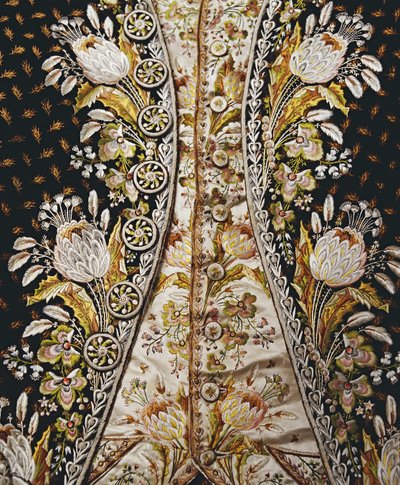 Detalhe do traje completo de um cavalheiro, incluindo casaco, colete e calças, entre os anos 1780 e 90 de English School