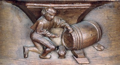 Escultura representando um homem colocando uma torneira em um barril, de uma tenda do coro da Abadia de St. Lucien em Beauvais (madeira) de French School