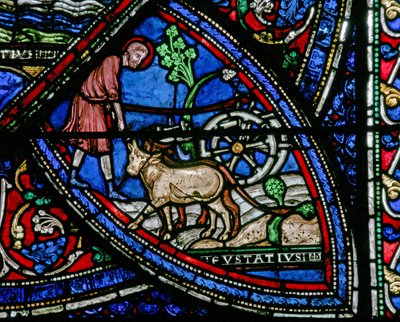 Janela w21 representando uma cena da vida de St Eustache: ele trabalha a terra de French School
