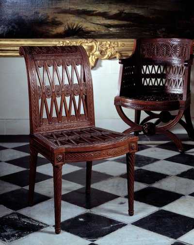 Cadeira comissionada para a leiteria da Maria Antonieta. Mobiliário em mogno esculpido por Georges Jacob (1739-1814) de Georges Jacob