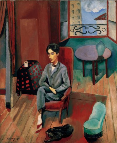 Jean Cocteau sentado no seu estúdio de Moise Kisling