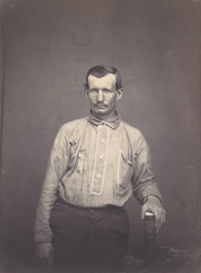 Homem segurando o livro do escritório de patentes, ca. 1857. de Oliver H. Willard.
