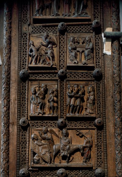 Arte românica: porta de madeira de meados do século XII da Igreja de Santa Maria do Capitólio em Colónia, Alemanha (Sankt Maria im Kapitol, Koln). Cenas que mostram o anúncio aos pastores, a natividade, a adoração dos magos e o de Romanesque