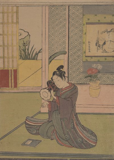 Jovem tocando um tambor Noh. de Suzuki Harunobu