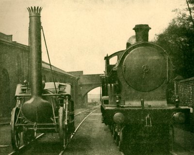 Um modelo em tamanho real do foguete Stephensons ao lado de um motor da George a quinta classe, Londo de Unbekannt