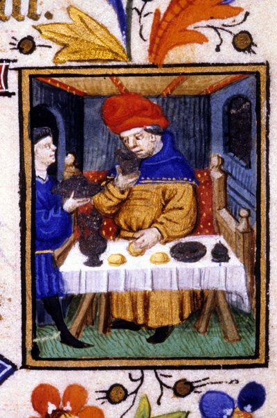 Desempenho do mês de Janeiro. Um criado põe comida na mesa do seu amo. Miniatura de um manuscrito do século XIV. de Unknown artist