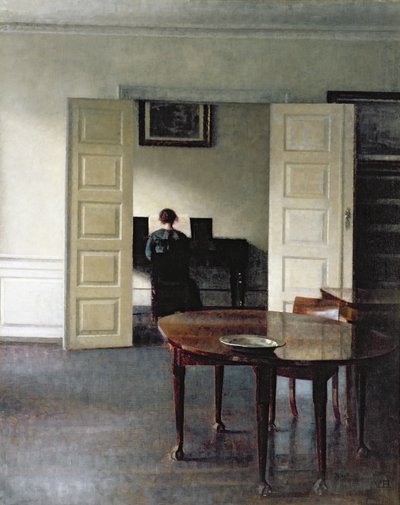 Um interior com uma mulher tocando piano, 1910 de Vilhelm Hammershoi