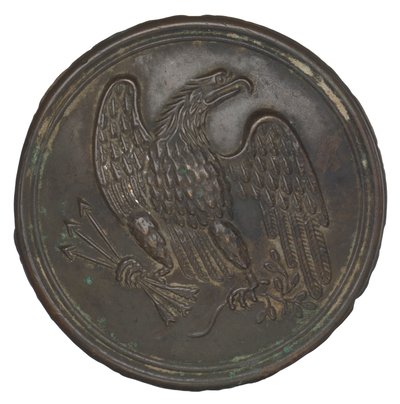 Placa com um desenho de águia de latão estampado a partir de uma correia de caixa de cartucho, 1862-1865. de Warren H. Wilkinson