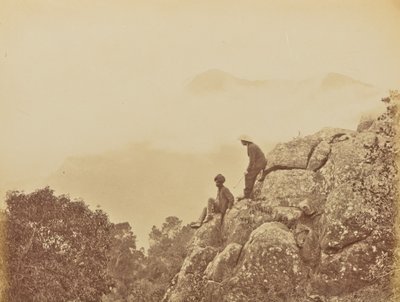 [Homens de pé sobre formações rochosas]. de Willoughby Wallace Hooper
