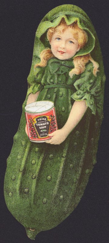 Menina, vestido como um pepino, segurando uma lata de sopa de tomate Heinz de American School