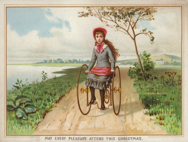 Menina andando de triciclo no país de American School