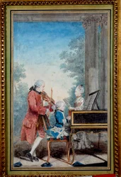 Wolfgang Amadeus Mozart (1756-1791) em criança a tocar piano com o pai e a irmã