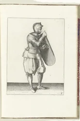 O exercício com a carga e o espadim: o soldado segura a carga com a mão direita e agarra o cinto com a esquerda (n.º 3), 1618
De Nassausche Wapen-Handelinge, van Schilt, Spies, Rappier ende Targe : beyde figuerlick afgebebeelt, ende gestelt na de