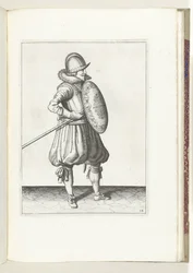 O exercício com escudo e lança: o soldado coloca a lança em posição de arrastar em duas vezes, segundo movimento (n.º 14), 1618
De Nassausche Wapen-Handelinge, van Schilt, Spies, Rappier ende Targe : beyde figuerlick afgebebeelt, ende gestelt na de nieuwe