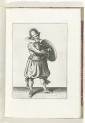 O exercício com escudo e lança: o soldado tira o seu espadim de trás do seu escudo (n.º 18), 1618
De Nassausche Wapen-Handelinge, van Schilt, Spies, Rappier ende Targe : beyde figuerlick afgebebeelt, ende gestelt na de nieuwe ordening [van] (...) Maurits 