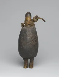 Figura Yaka (madeira, tecido, casca, fibra e materiais orgânicos)