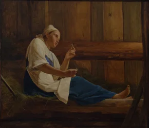 Menina em um colchão de feno