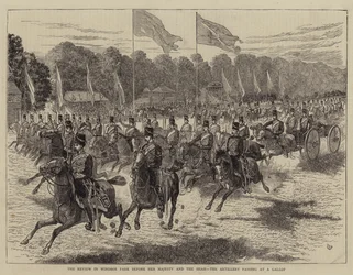A revisão no parque de Windsor antes de sua majestade e o xá, a artilharia que passa em um galope