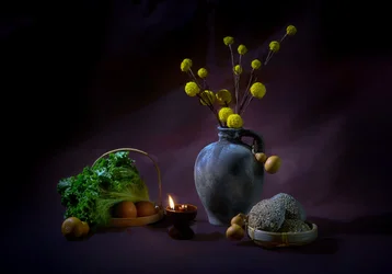 Natureza-morta de colheita à luz das velas