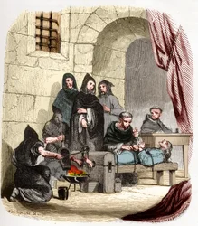 Inquisição em Espanha no século XV: Maria da Borgonha (1457-1482), acusada de ser judia, é torturada por são Pedro de Arbues (1441/1442-1485), inquisidor espanhol: ele queima-lhe os pés. Ilustração em «Mistérios da Inquisição» e