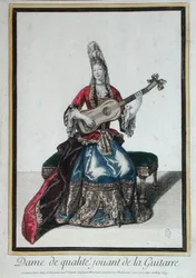 Senhora a tocar guitarra