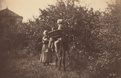 Duas mulheres com um burro, finais da década de 1870 (foto)